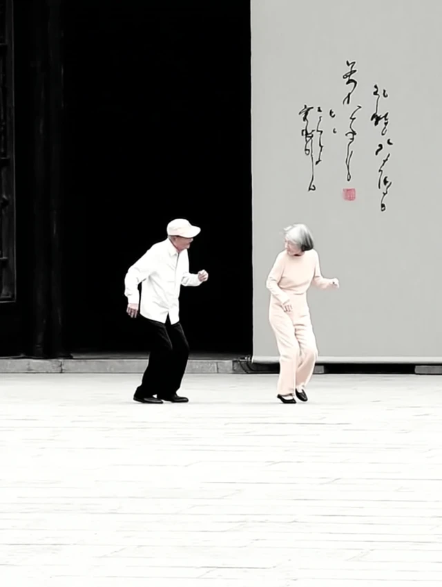 Elderly Couple Dancing in the City Square