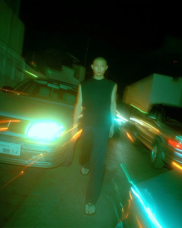 Tokyo Night Alley Scene with Man in Black