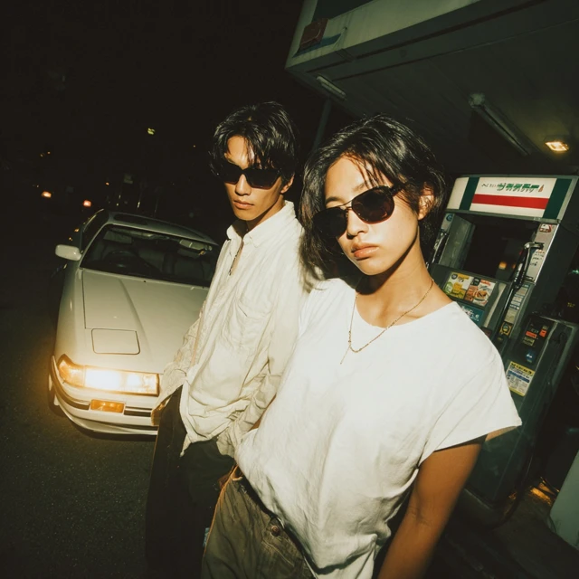 Japanese Couple in 80s Fashion at Gas Station
